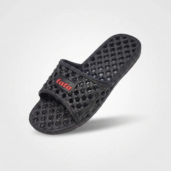 Junction Sole black honeycomb-textured slipper angled top view, breathable EVA anti-slip sandal for men and women in Pakistan homes.