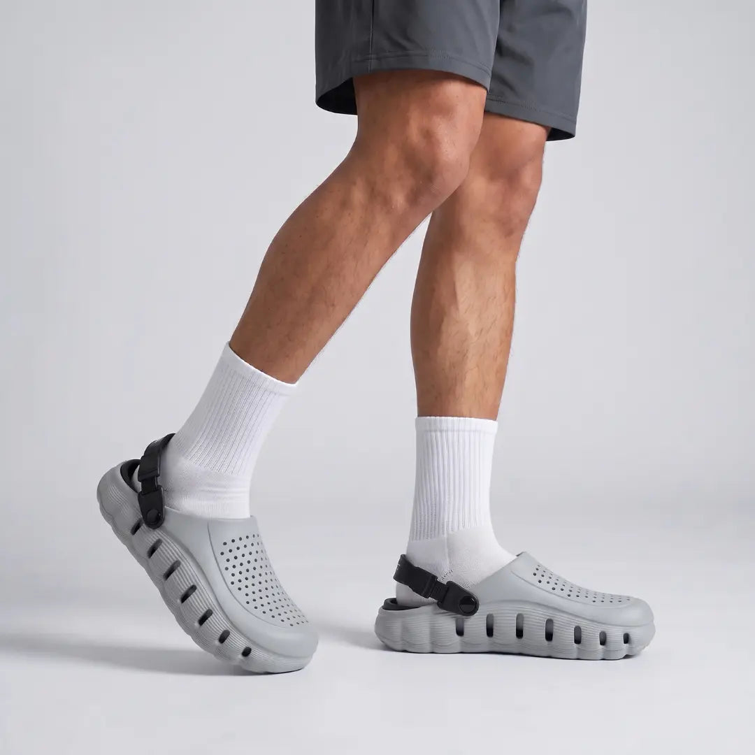 Man walking in grey JunctionSole clogs with white socks casual comfort wear