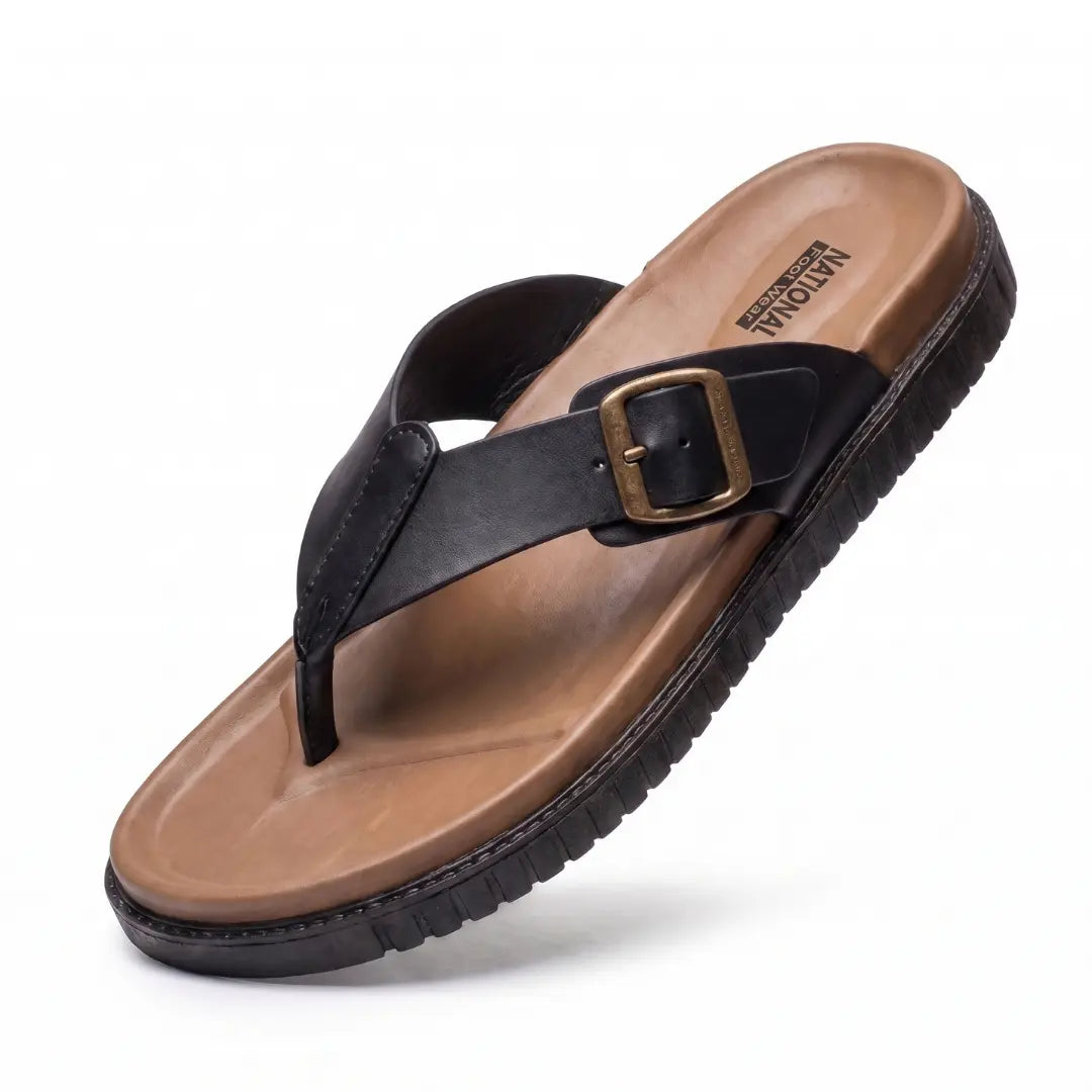 Junction Sole men's black comfort walking slippers with brass buckle and tan cushioned footbed, lightweight and anti-slip for daily use in Pakistan.