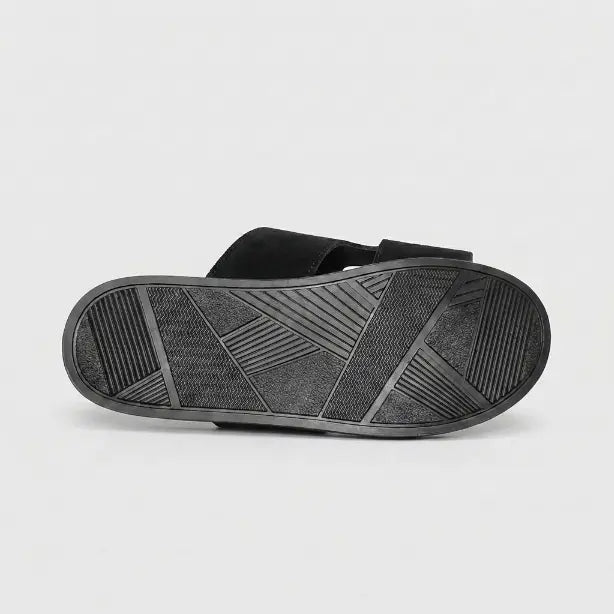 Junction Sole men's black comfort slides showing durable geometric-tread outsole designed for anti-slip grip and long-lasting daily wear.