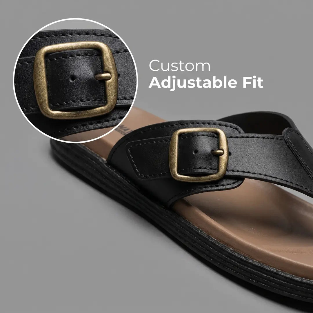 Close-up of Junction Sole black comfort slippers' brass adjustable buckle, designed for a secure custom fit on every foot width.